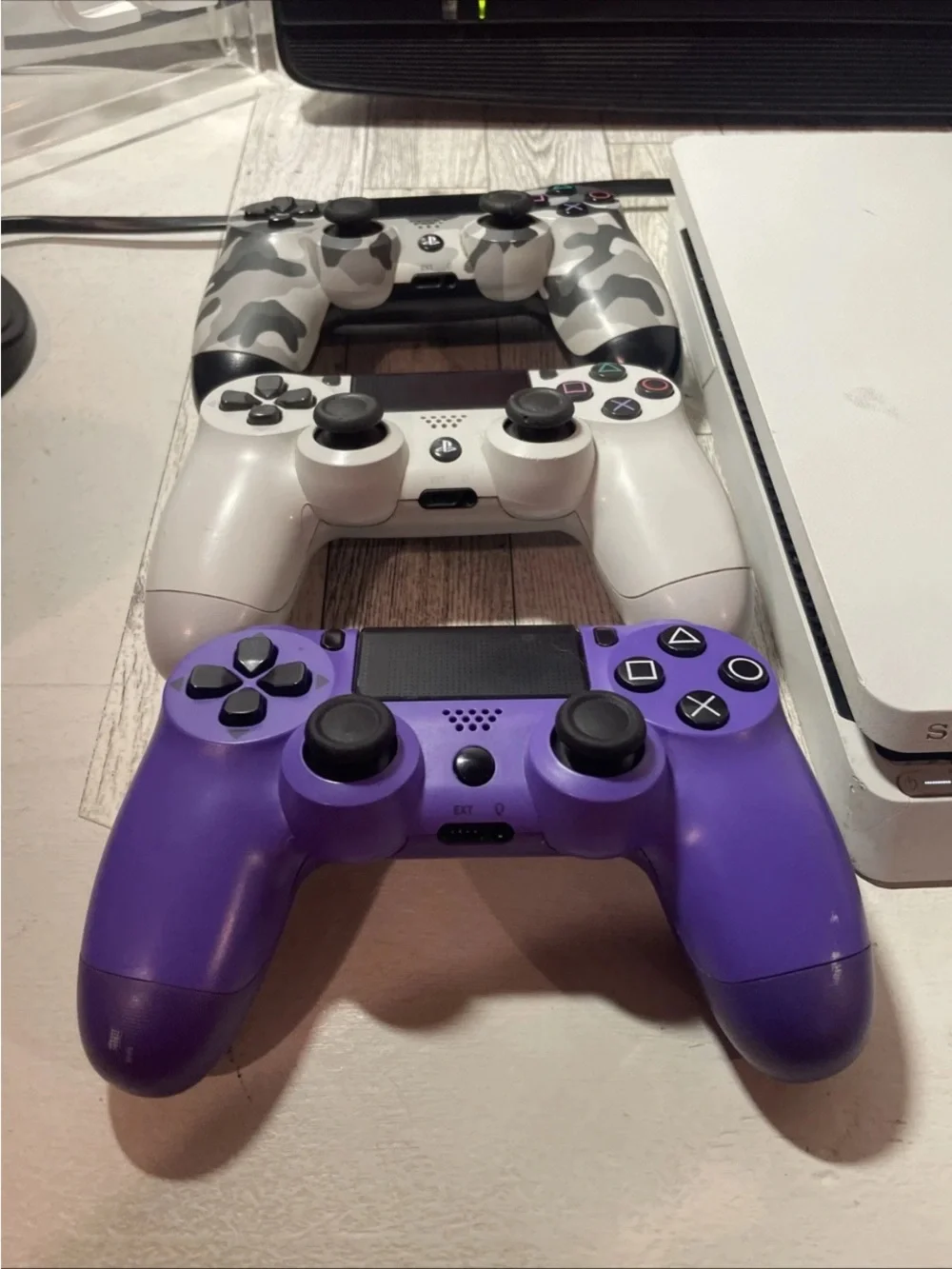 Sony White PS4 Slim with White, Purple and Camo Controllers